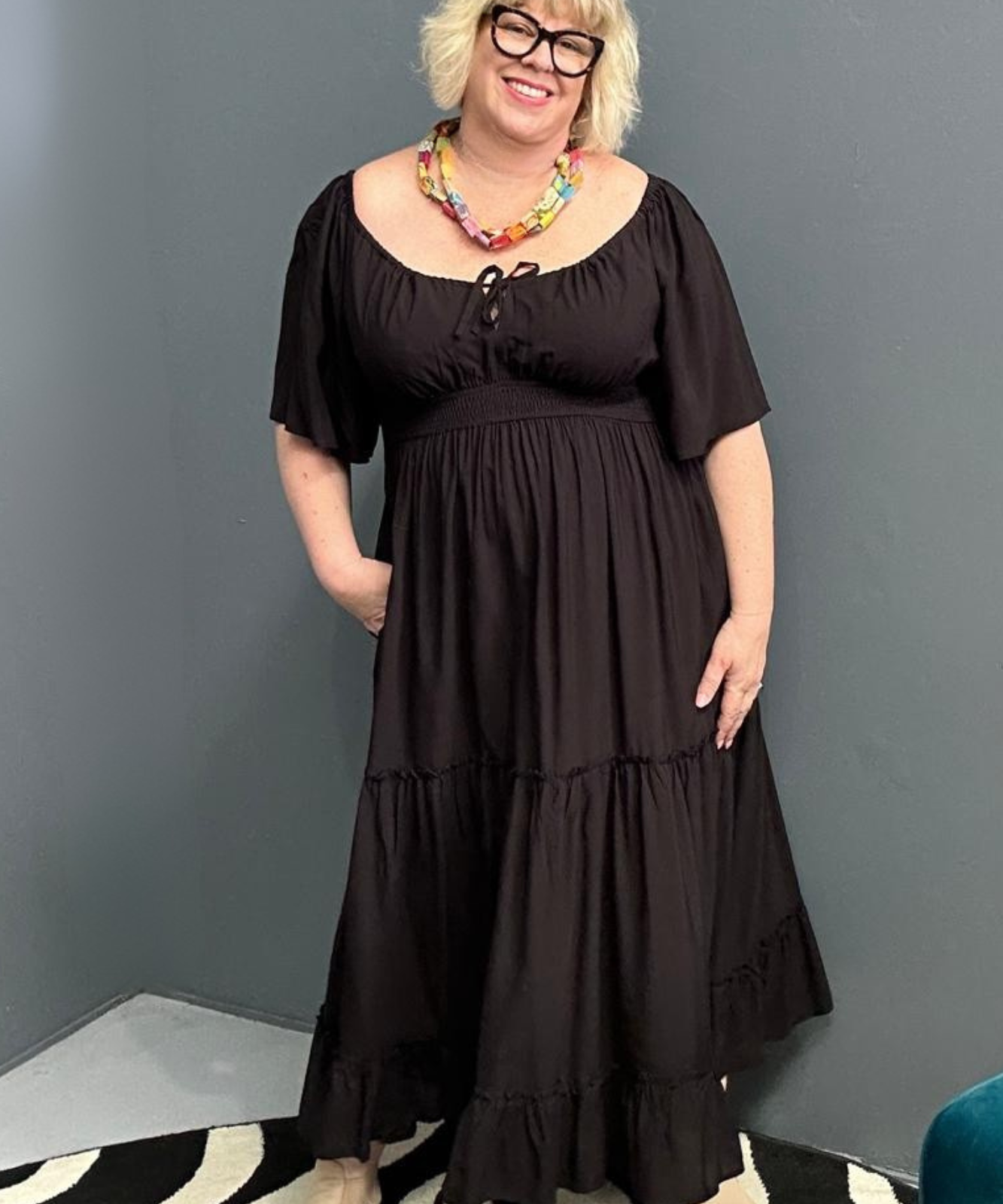 Plus-size black dress with a soft, flowy fit.