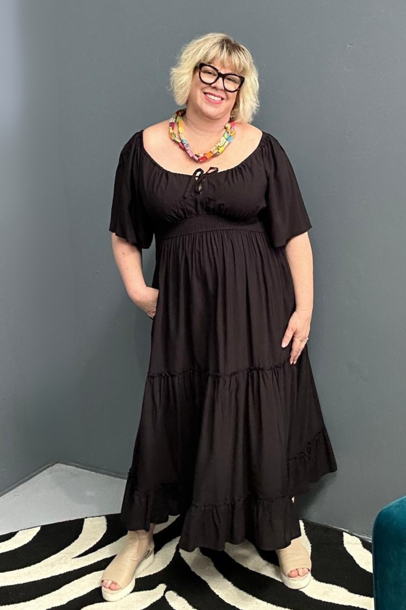 Plus-size black dress with a soft, flowy fit.