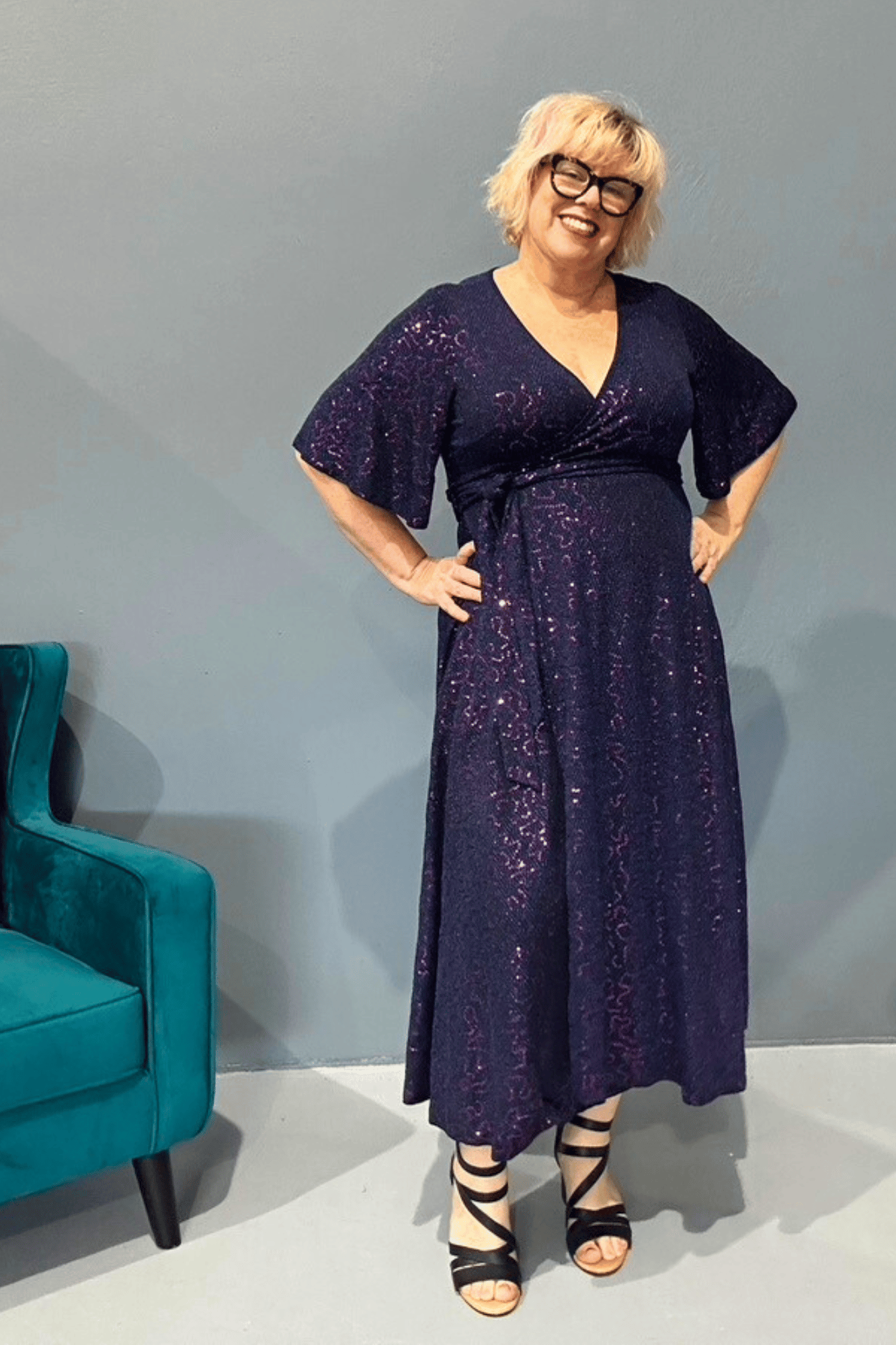 Marilyn wrap dress with cobalt blue metallic thread and pink sequins, designed to flatter all body types.
