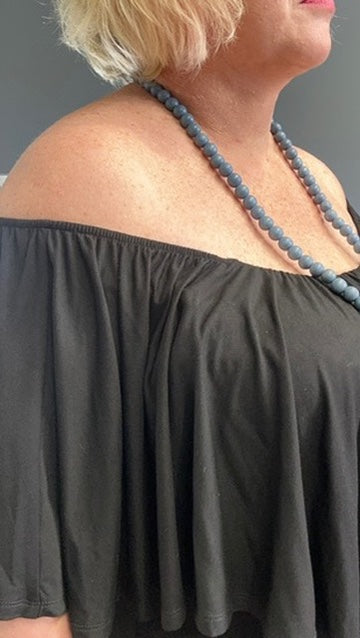 Plus-size black bamboo maxi dress with frill details, flowy fit.