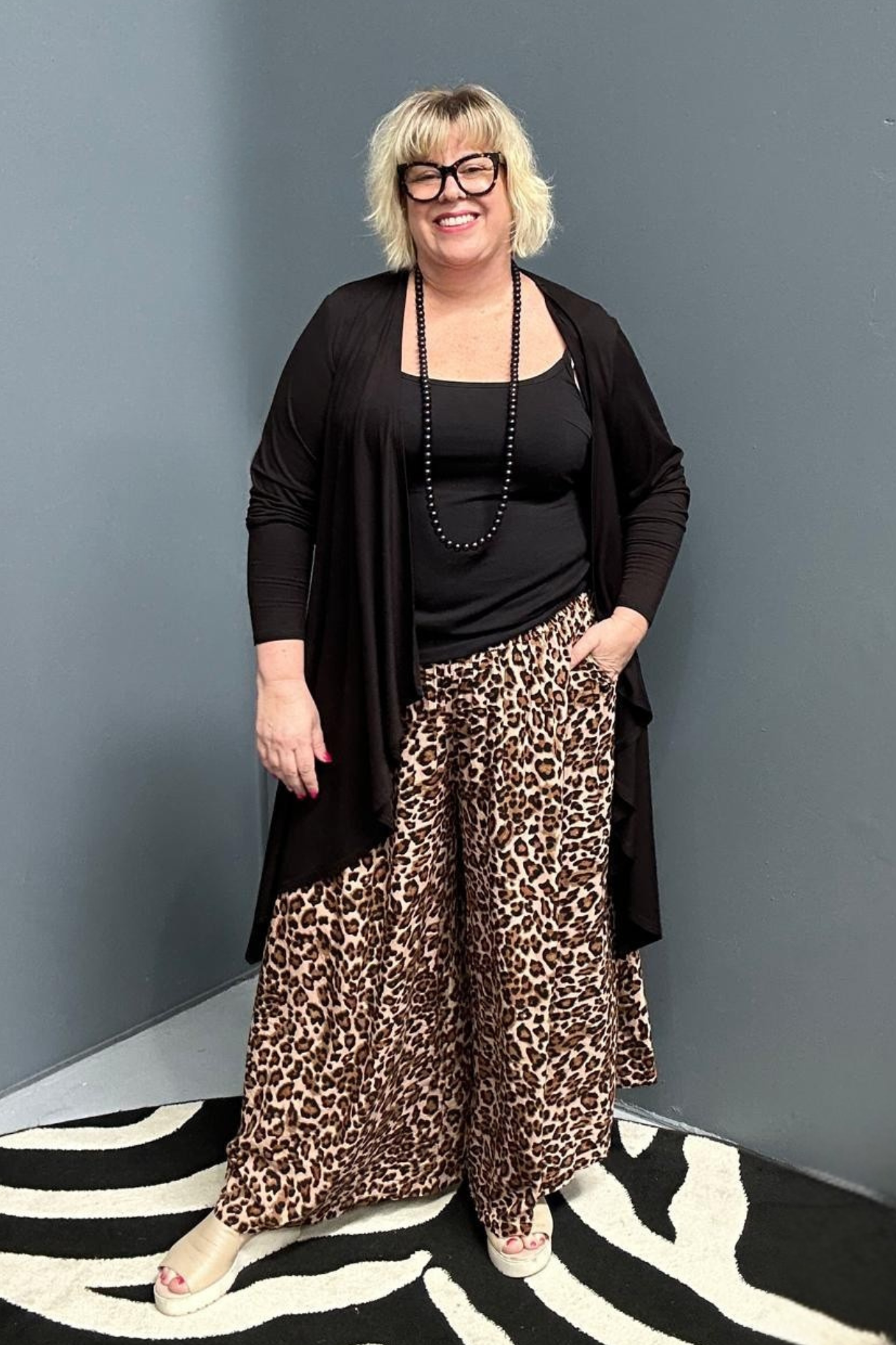 Plus-size black bamboo cardigan with a soft, flowy drape.