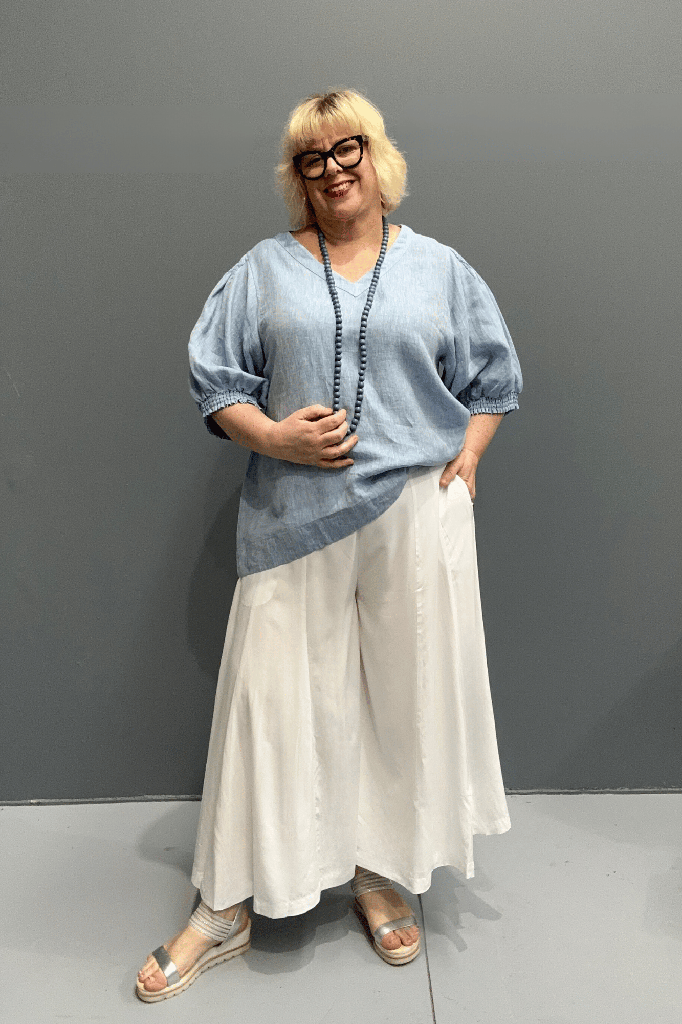 Plus size poppy print culottes that combine style and comfort, hanging like a skirt while offering the convenience of pants.