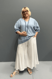 Plus size poppy print culottes that combine style and comfort, hanging like a skirt while offering the convenience of pants.