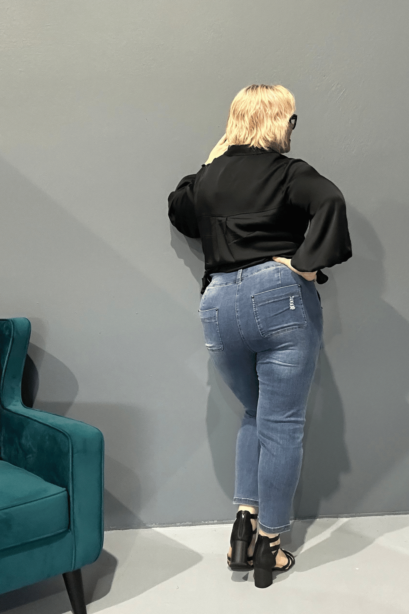 Slim-leg, high-waisted STELLA plus size jeans in distressed ultra-stretch denim for a flattering fit.