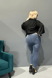 Slim-leg, high-waisted STELLA plus size jeans in distressed ultra-stretch denim for a flattering fit.