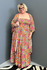 Plus-size sage green maxi dress with a flattering wrap fit and soft flow.