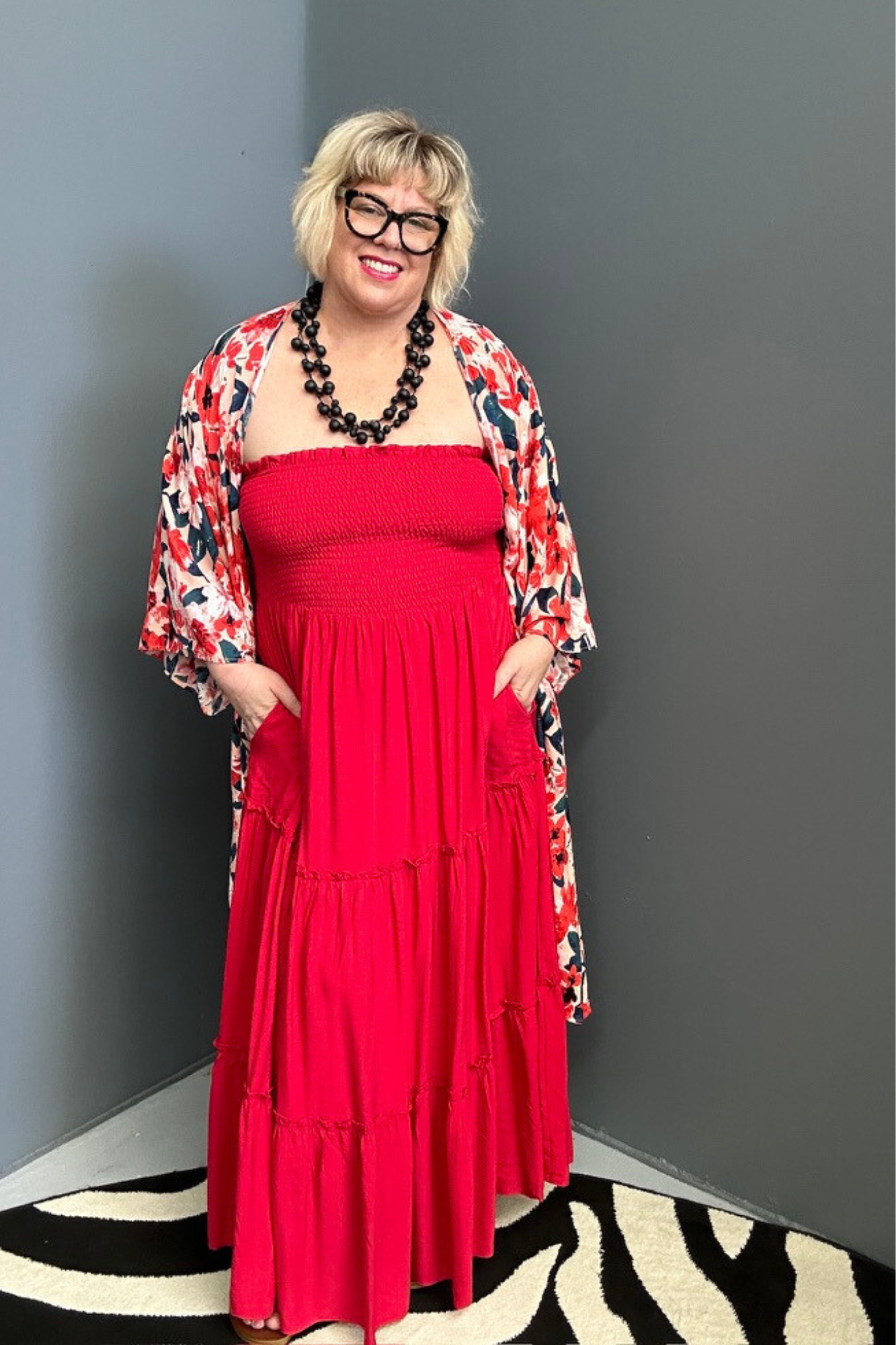 Plus-size red maxi dress with a flattering drape and effortless style.