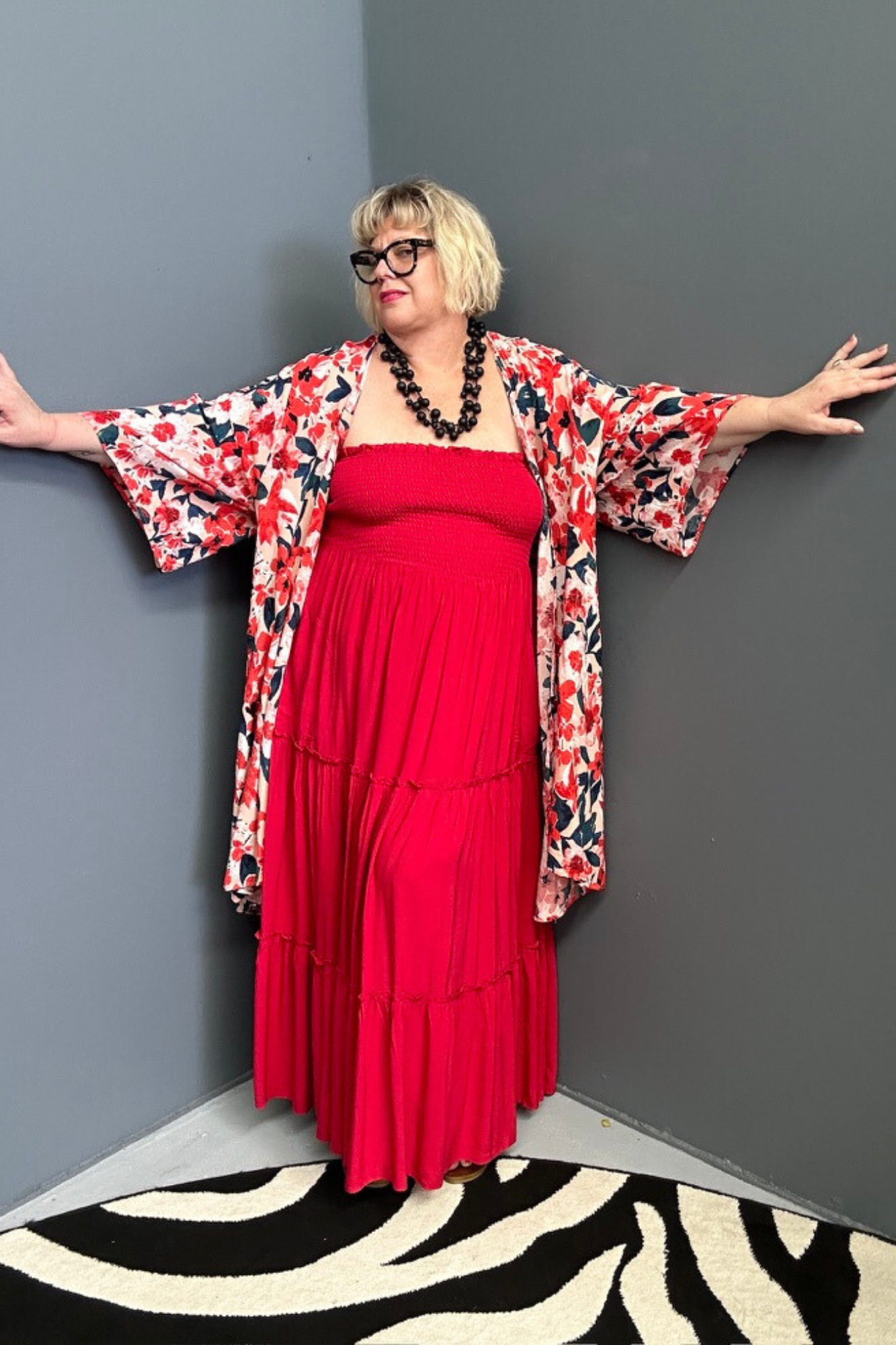 Plus-size red maxi dress with a flattering drape and effortless style.