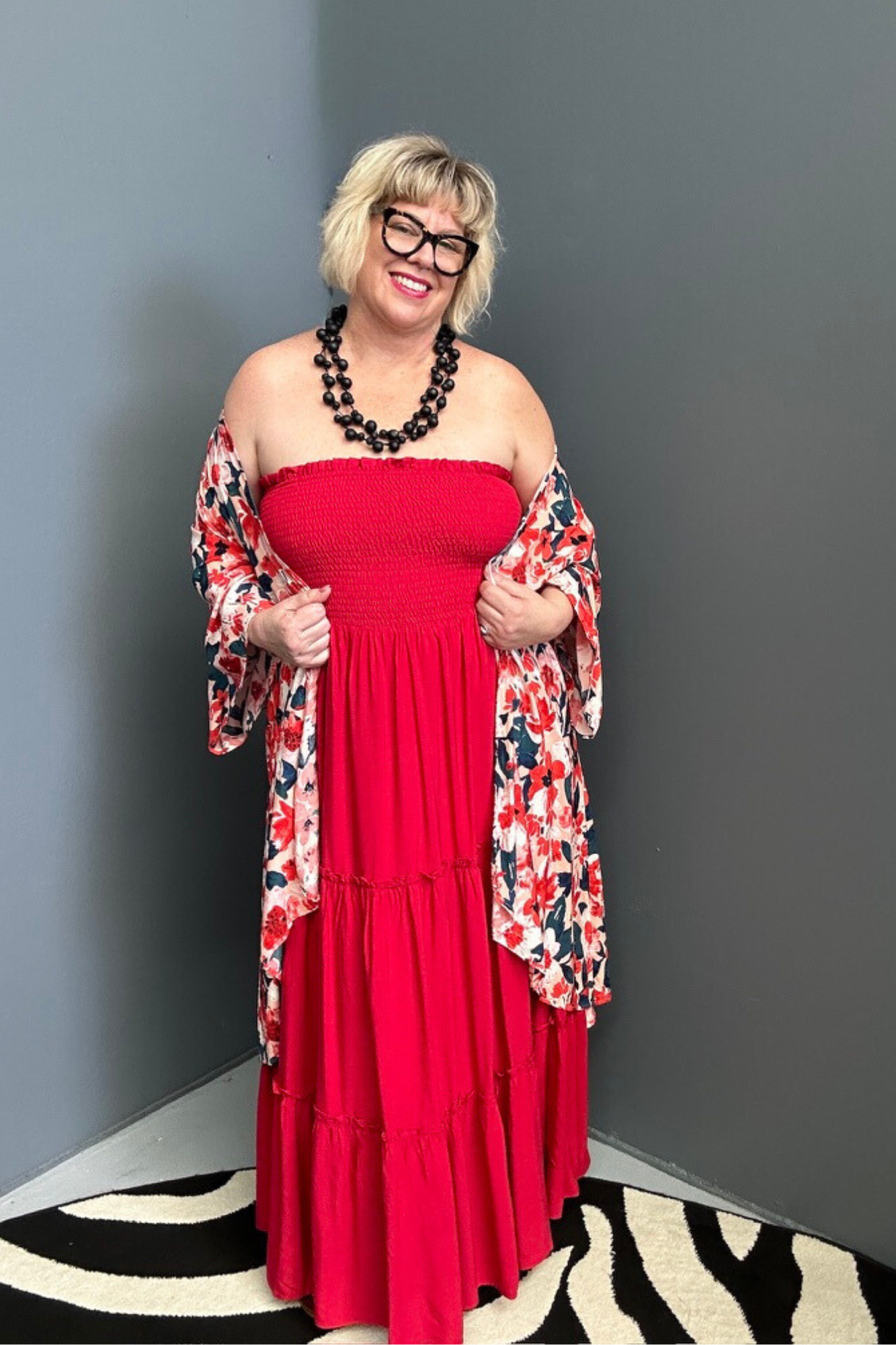 Plus-size red maxi dress with a flattering drape and effortless style.