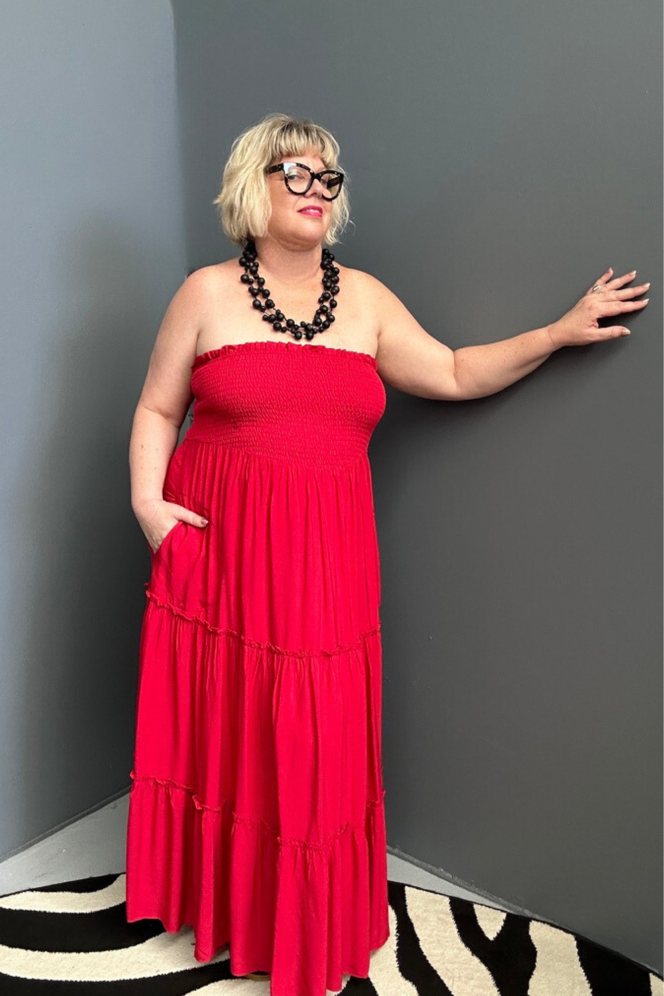 Plus-size red maxi dress with a flattering drape and effortless style.