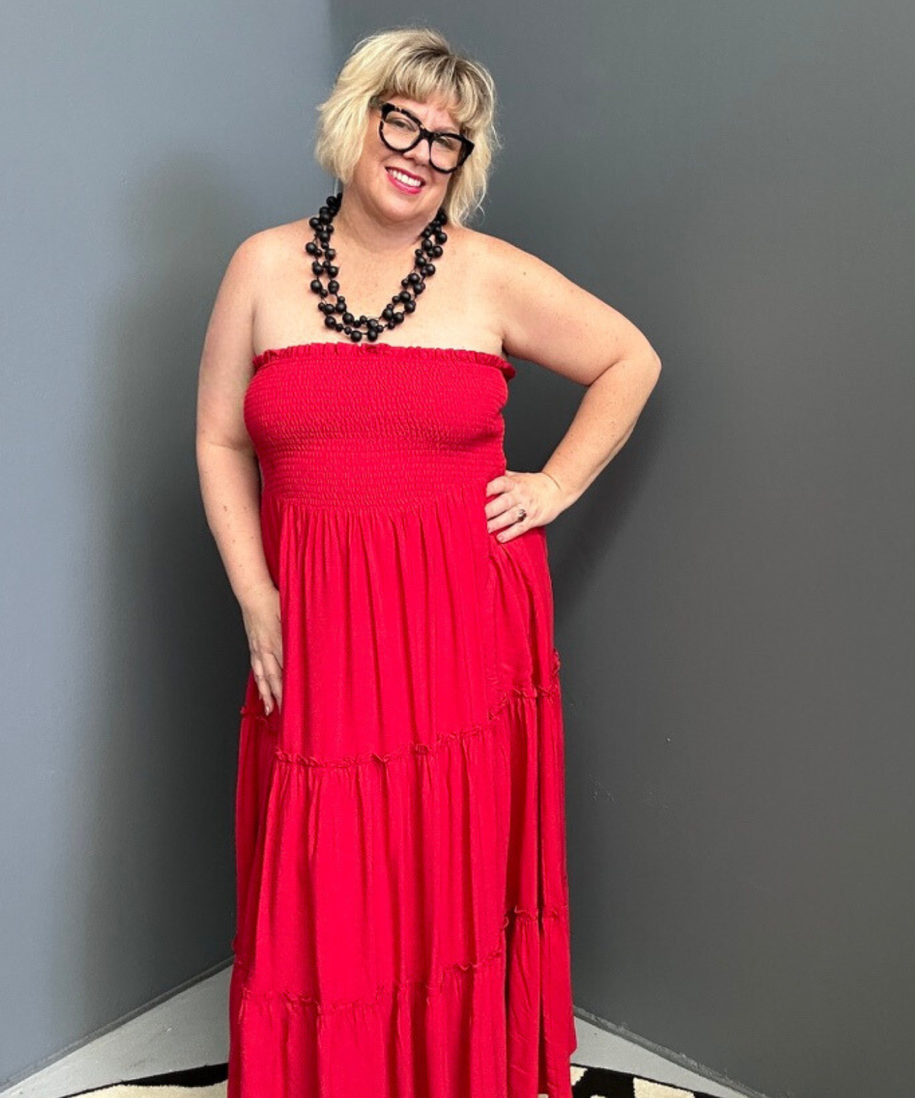 Plus-size red maxi dress with a flattering drape and effortless style.