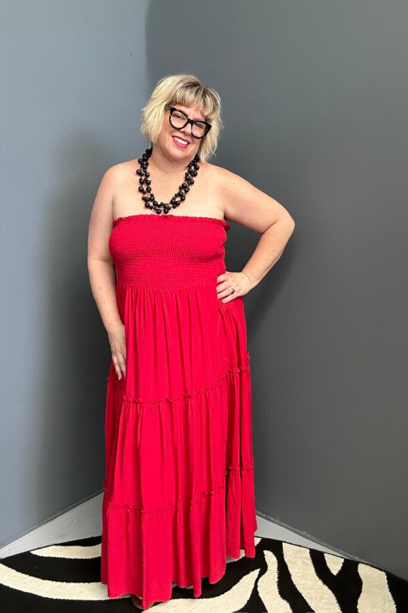 Plus-size red maxi dress with a flattering drape and effortless style.
