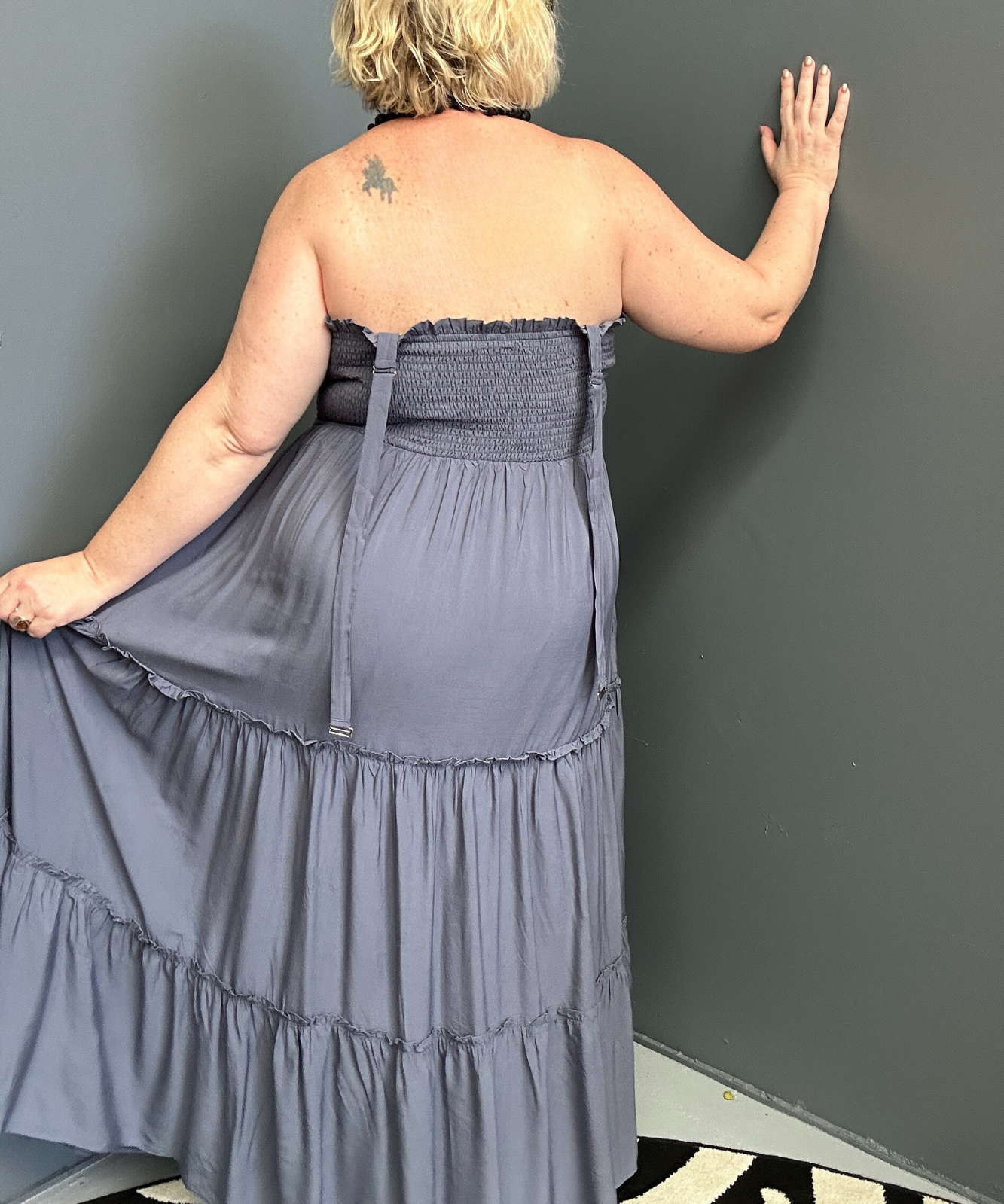Plus-size blue maxi dress with a flattering wrap design and soft drape.