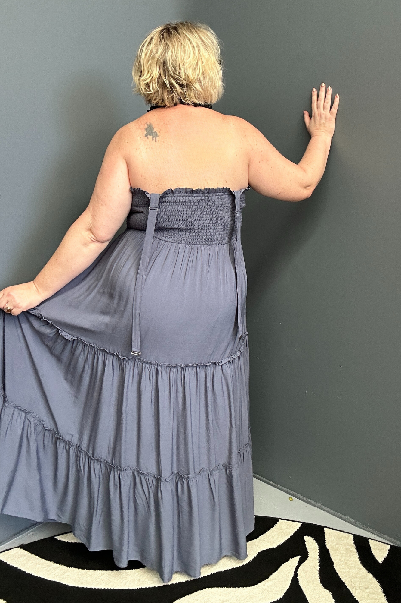 Plus-size blue maxi dress with a flattering wrap design and soft drape.