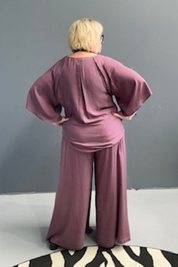 Flowy palazzo pants in a deep mulberry hue.