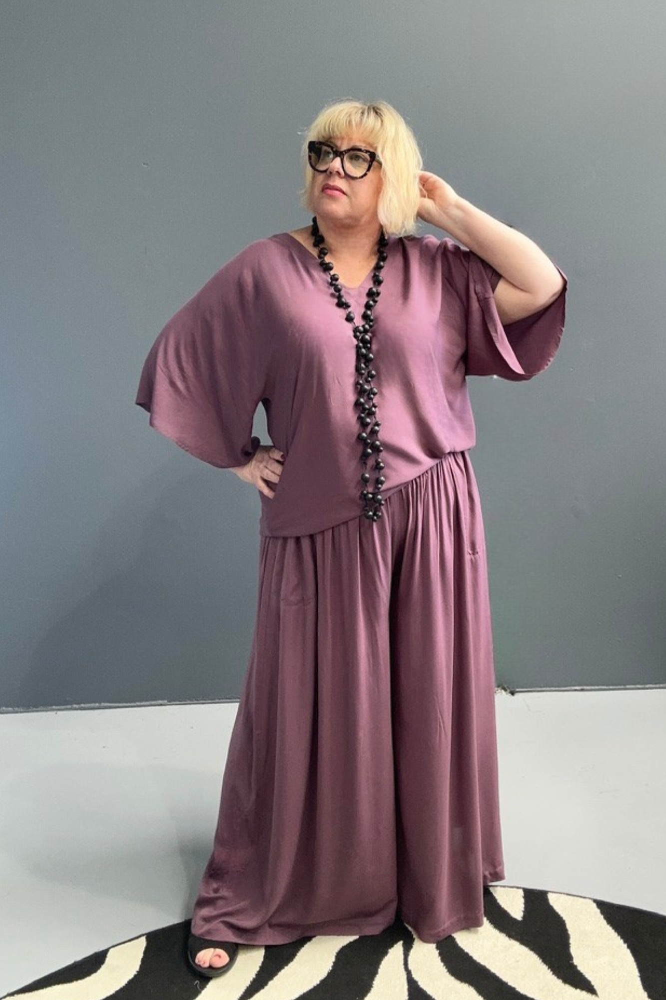 Flowy palazzo pants in a deep mulberry hue.