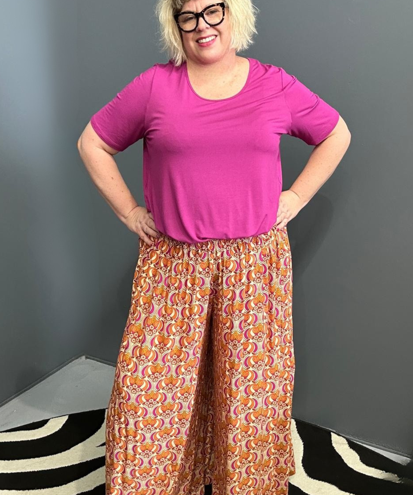 Flowy palazzo pants with a vibrant Orange Swirl print.