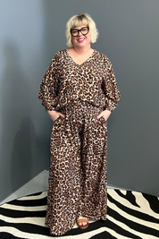 Flowy palazzo pants with a bold leopard print.