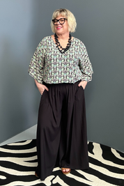 Flowy palazzo pants in a sleek black design.