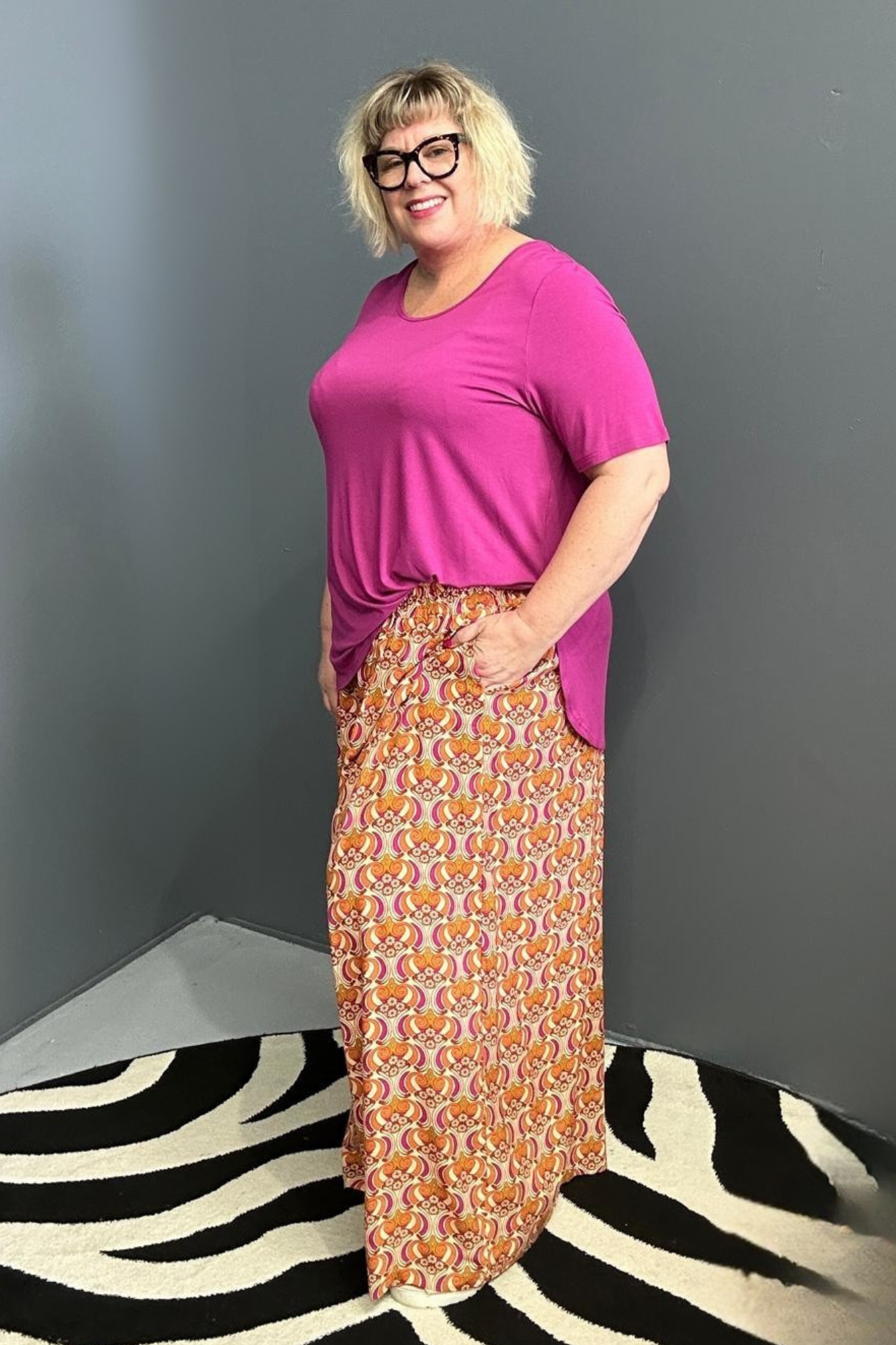 Flowy palazzo pants with a vibrant Orange Swirl print.