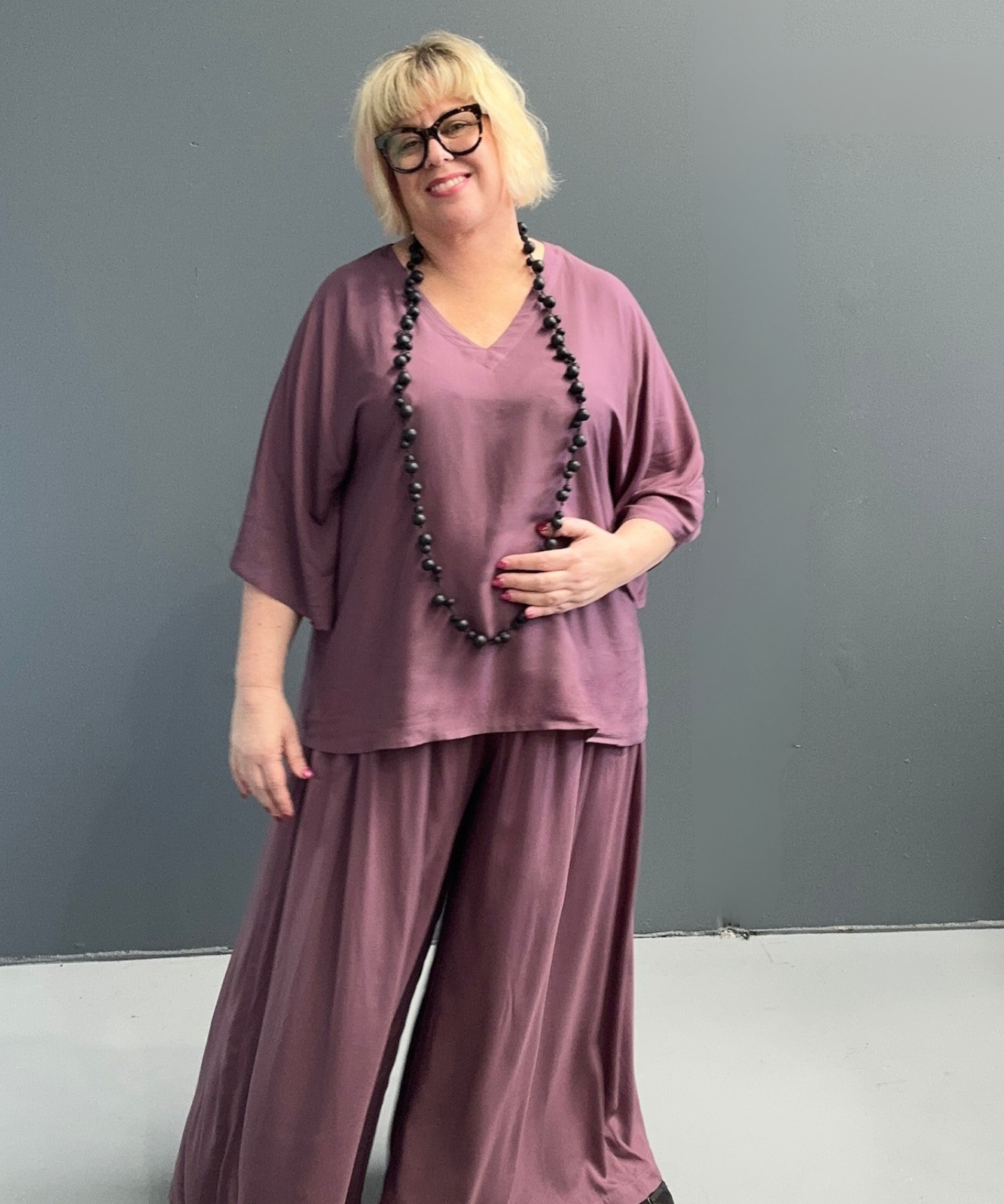 Flowy palazzo pants in a deep mulberry hue.