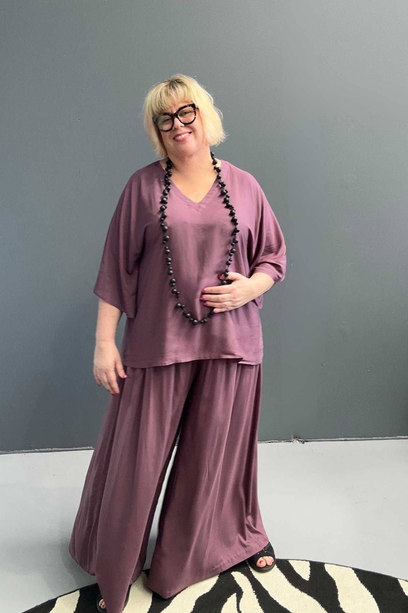Flowy palazzo pants in a deep mulberry hue.