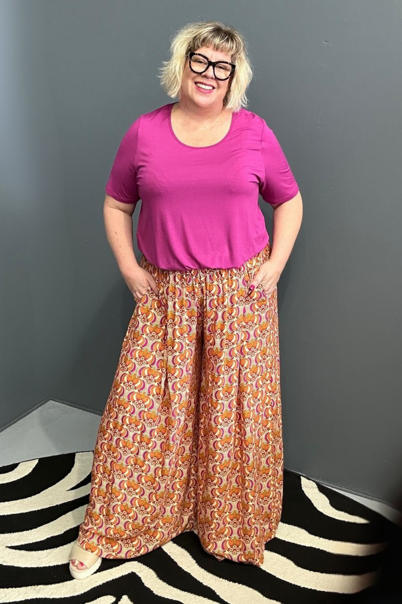 Flowy palazzo pants with a vibrant Orange Swirl print.