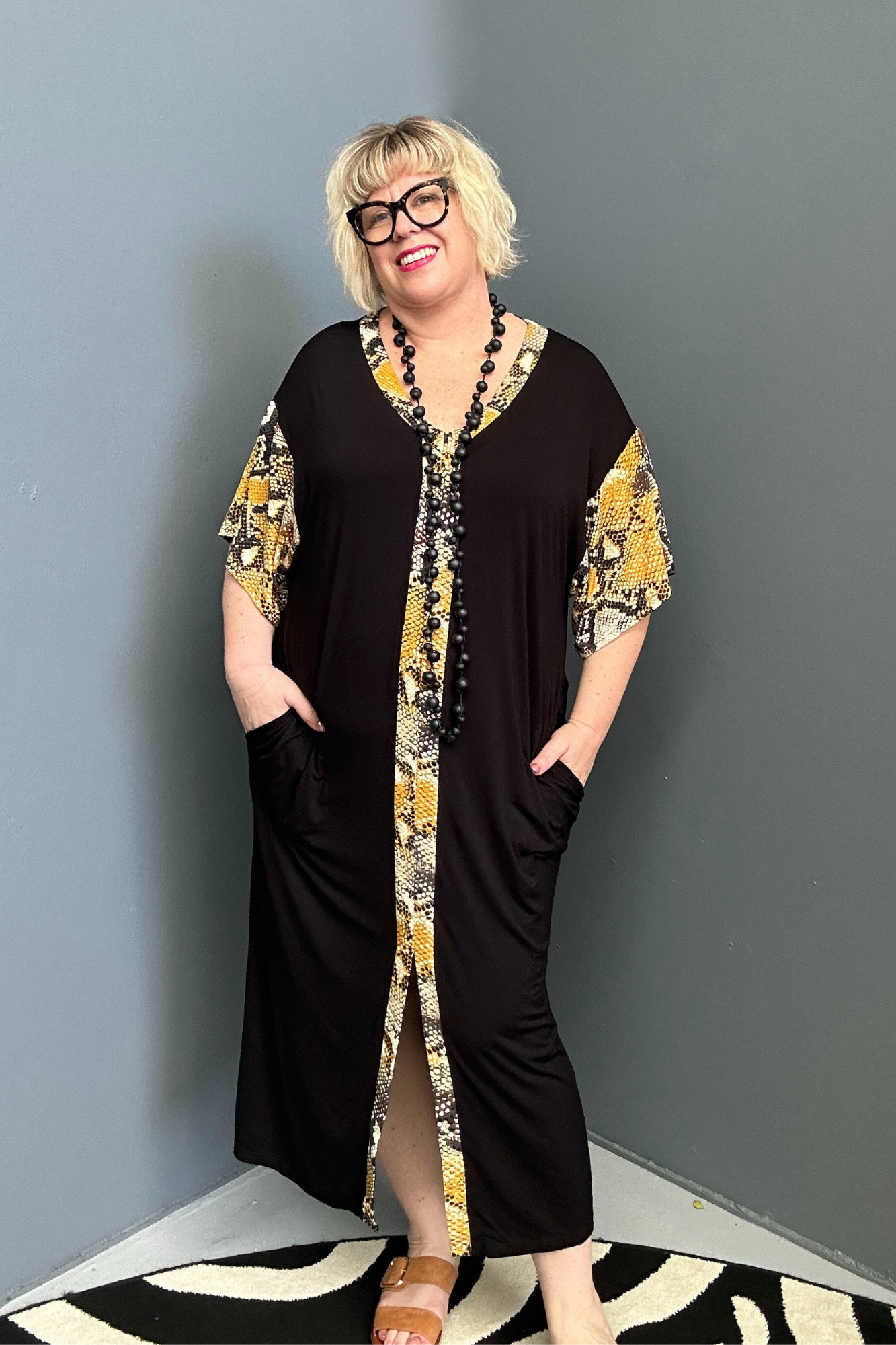 Plus-size TABOO bamboo maxi dress in a bold yellow and black design.