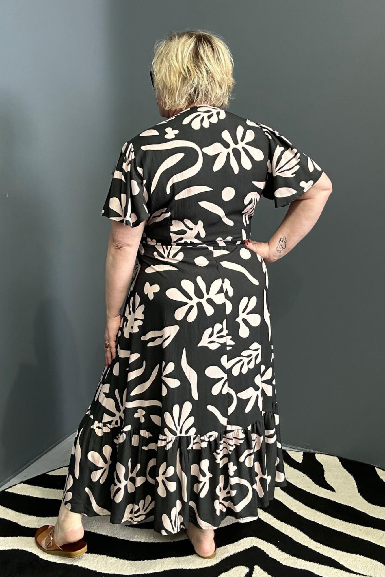 Flattering plus-size wrap dress in black and creme.