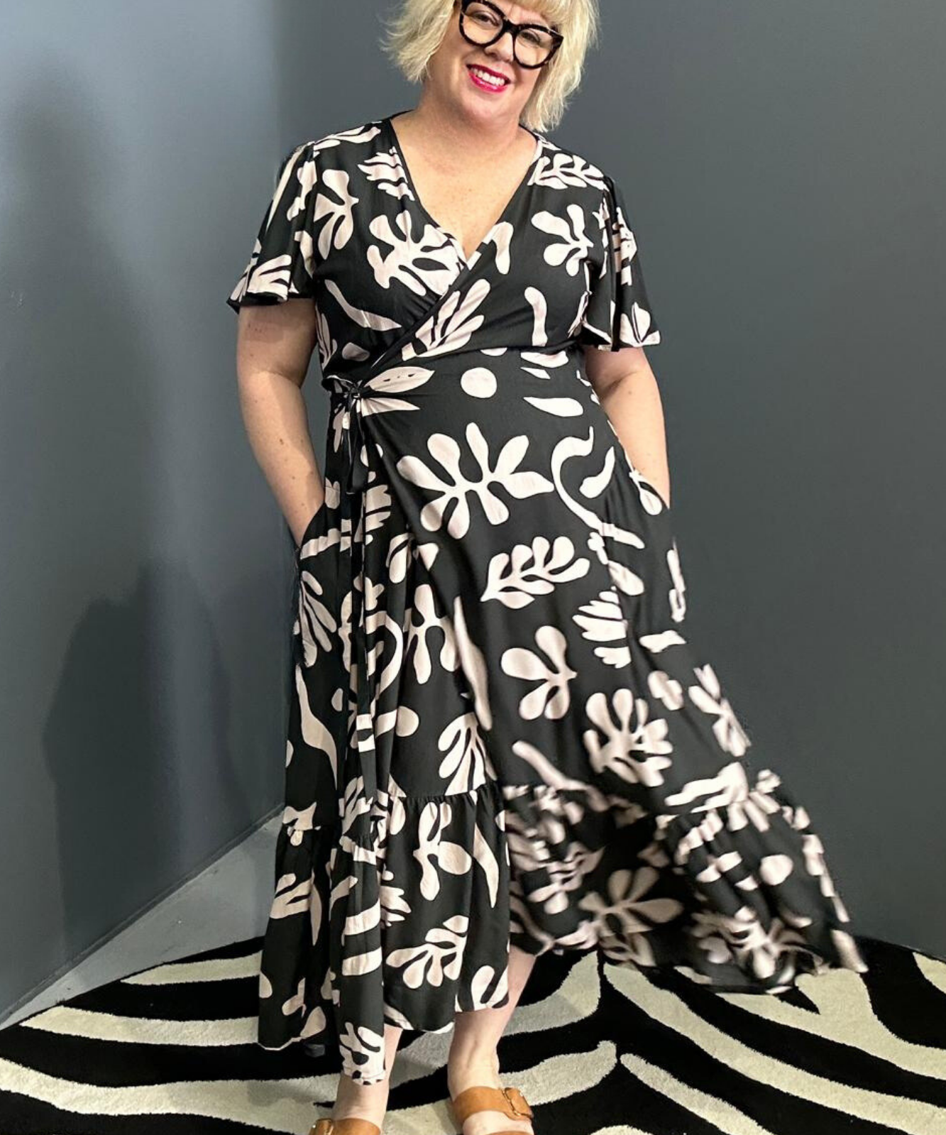Flattering plus-size wrap dress in black and creme.