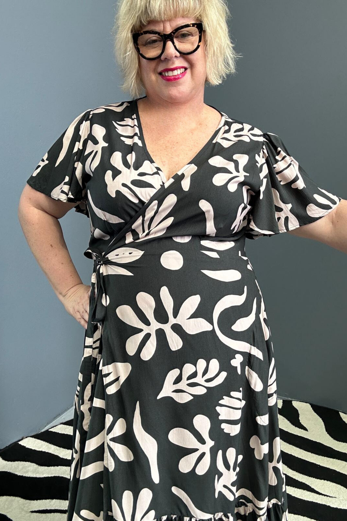 Flattering plus-size wrap dress in black and creme.