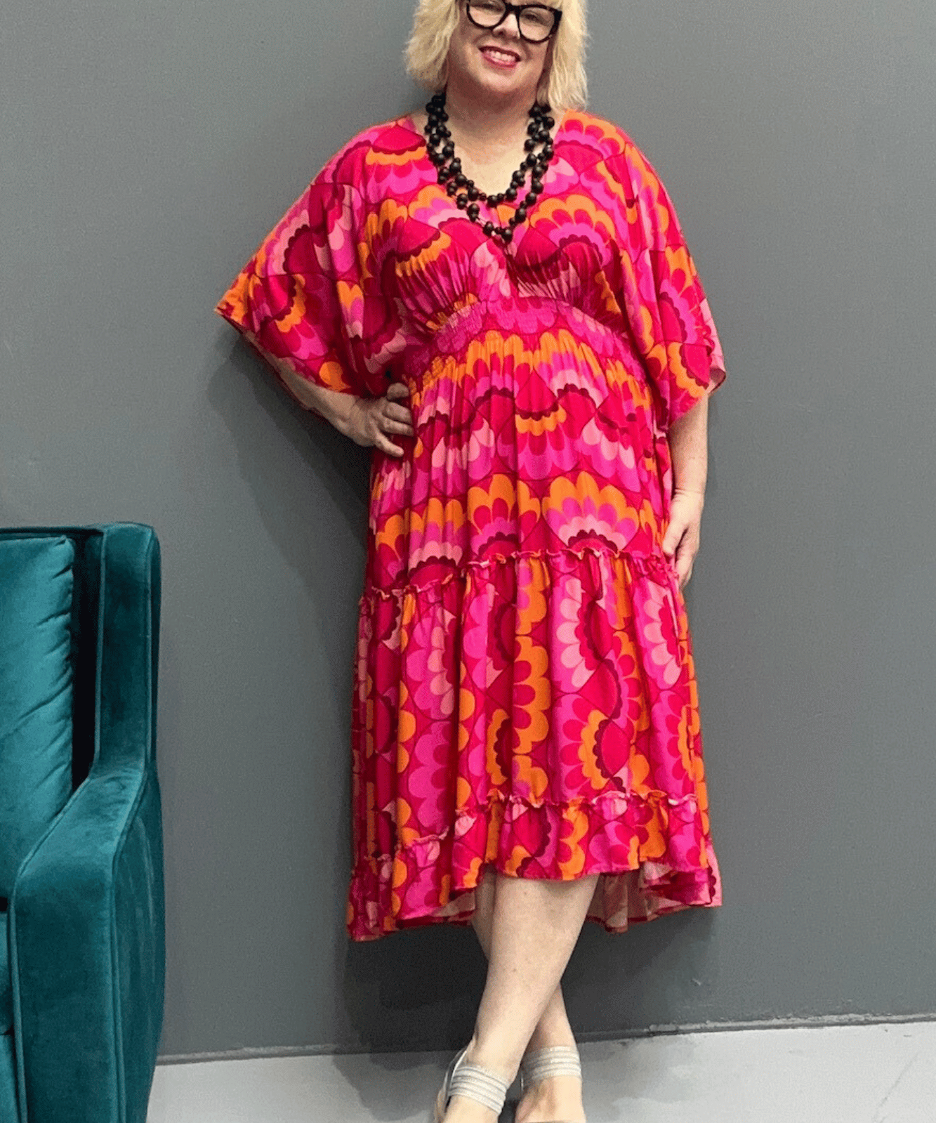 Floaty, tiered plus size dress for beach or casual outings, featuring a comfortable fit and versatile styling options.