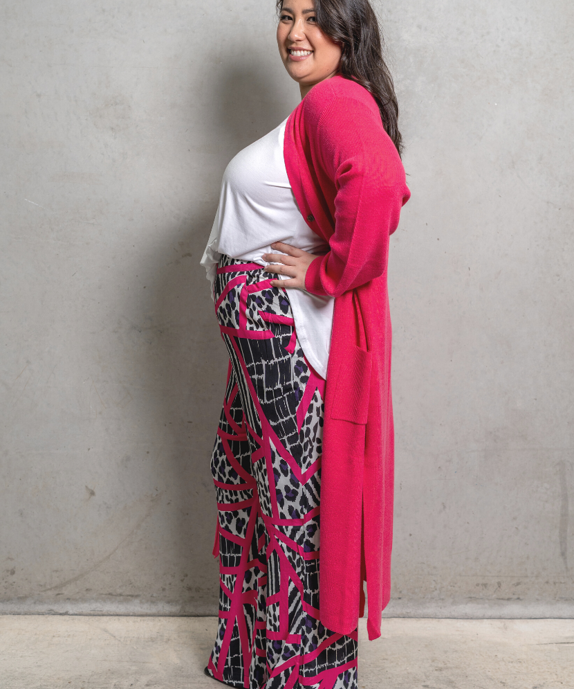 Plus size Pink Zebra Pants with a vibrant zebra print, wide-leg cut, and high waist, perfect for stylish women.
