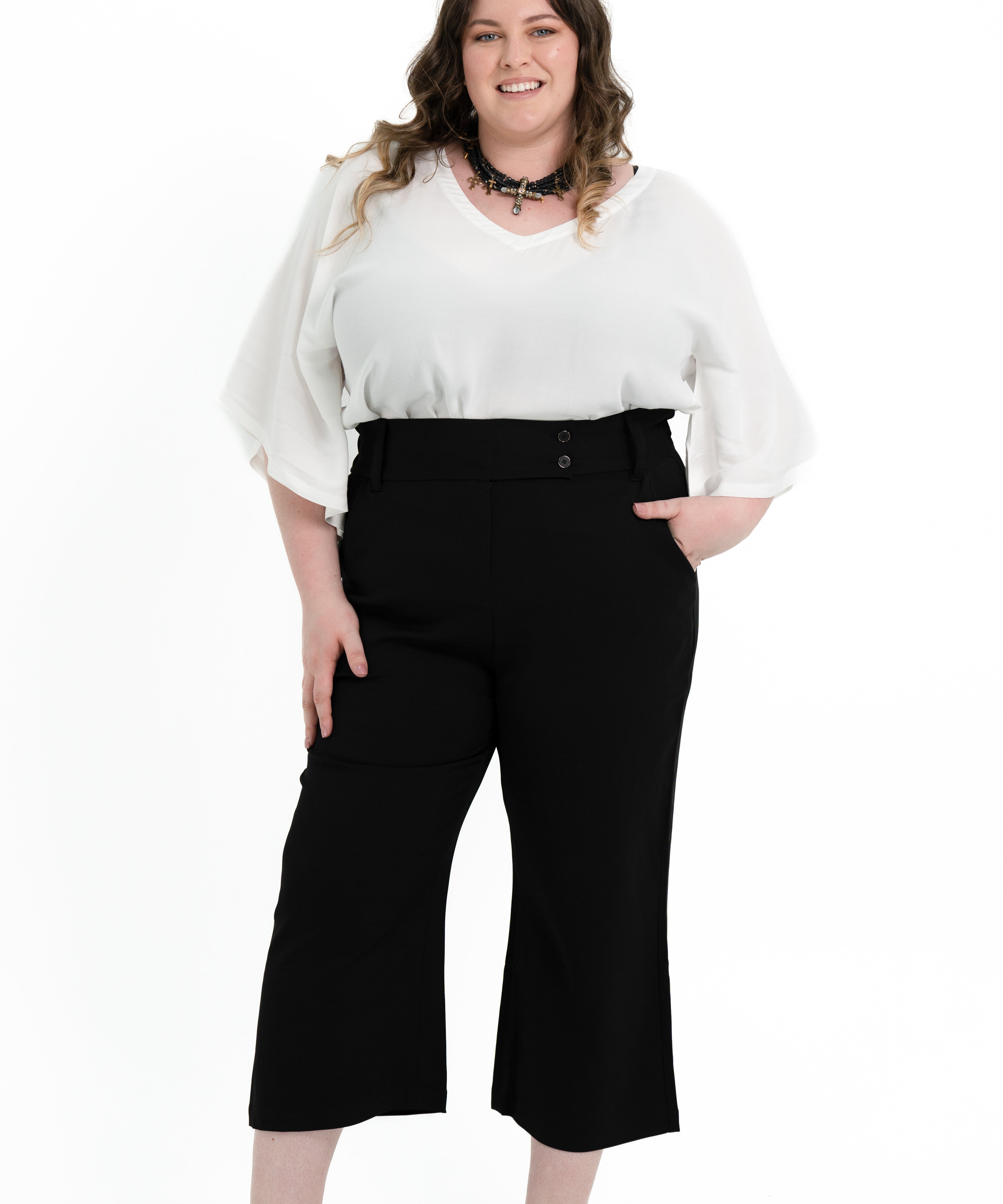 Black stretch crepe 'Power' pant with candy pink pocket lining, designed for plus size women to pair with matching blazer.