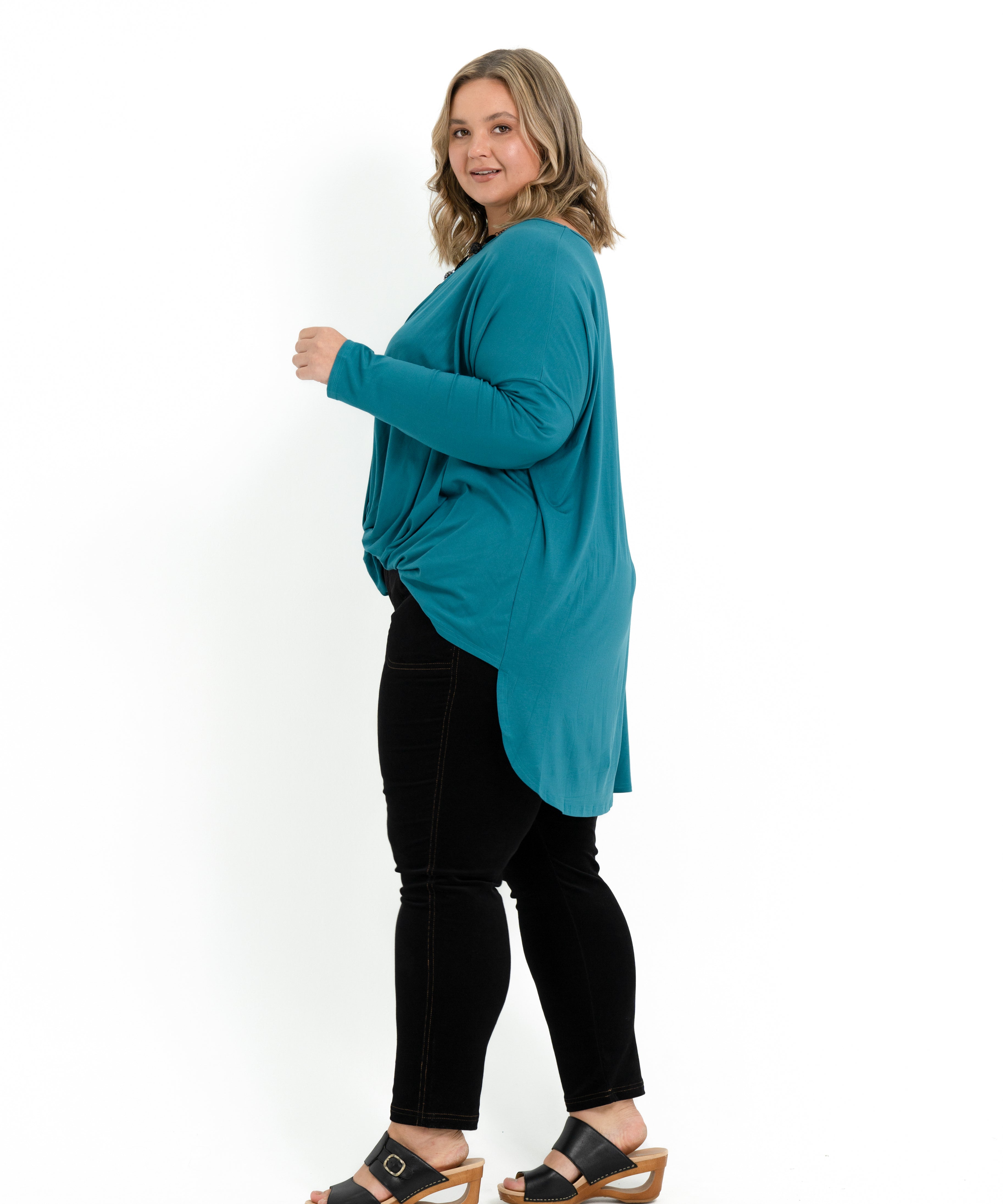 Teal bamboo twist front top for plus size women with long sleeves and a boat neckline.