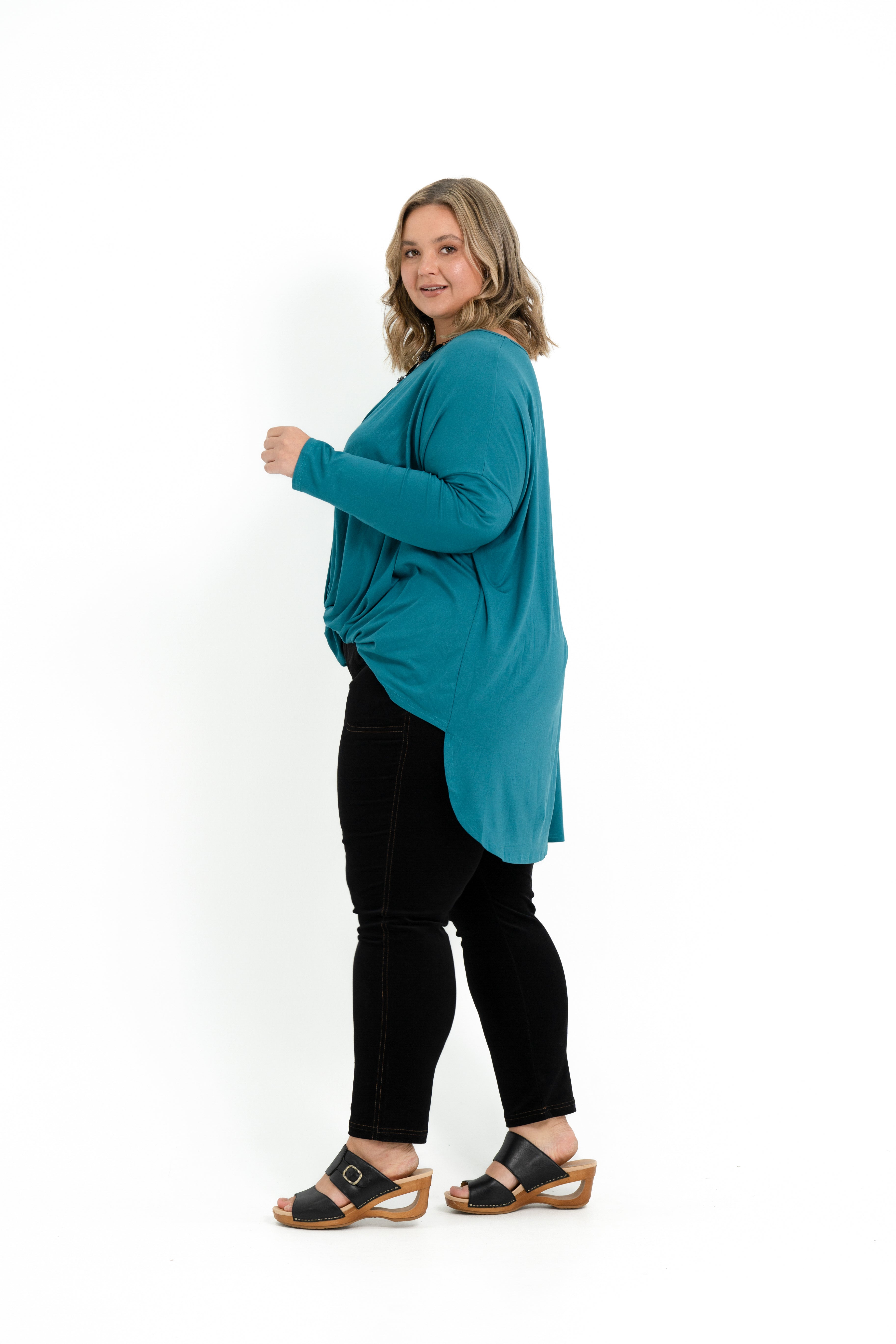 Teal bamboo twist front top for plus size women with long sleeves and a boat neckline.